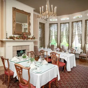 a room filled with furniture and a large window