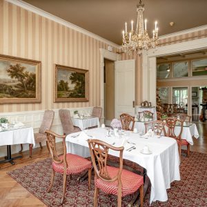 a living room filled with furniture and a large window