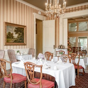a dining room table in front of a window