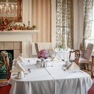 a dining room table in front of a window