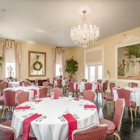 a hotel room filled with furniture and a large window