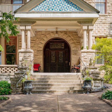 a large stone statue in front of a building