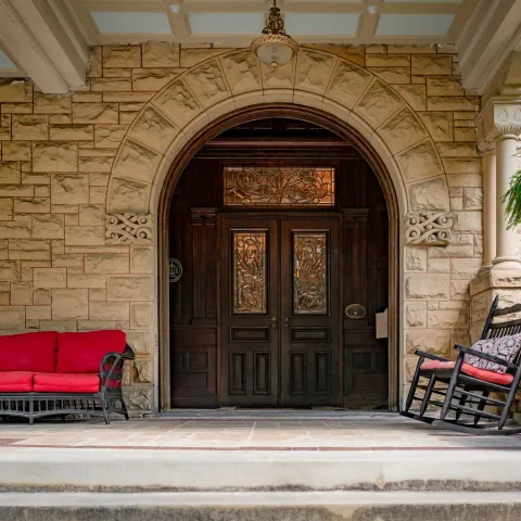 a large stone statue in front of a building