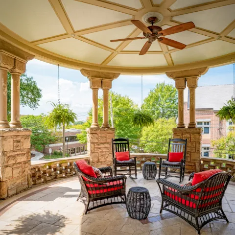 a chair sitting in front of a building