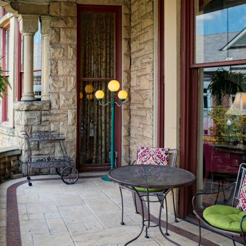a living room filled with furniture and a fireplace